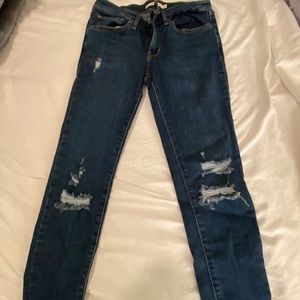 Levi 711 distressed jeans.